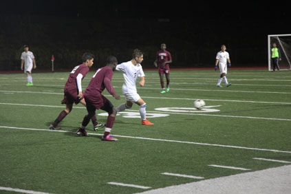 Bruno Da Silva Pereira passing the ball away from the opponent.