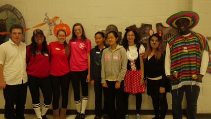 The members of Malden High School's Helping Hands club posing for a picture after the dance.
