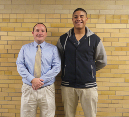 Coach Smith and senior Martiz Ortiz posing for a picture. Photo taken by Cassandra Reyes.