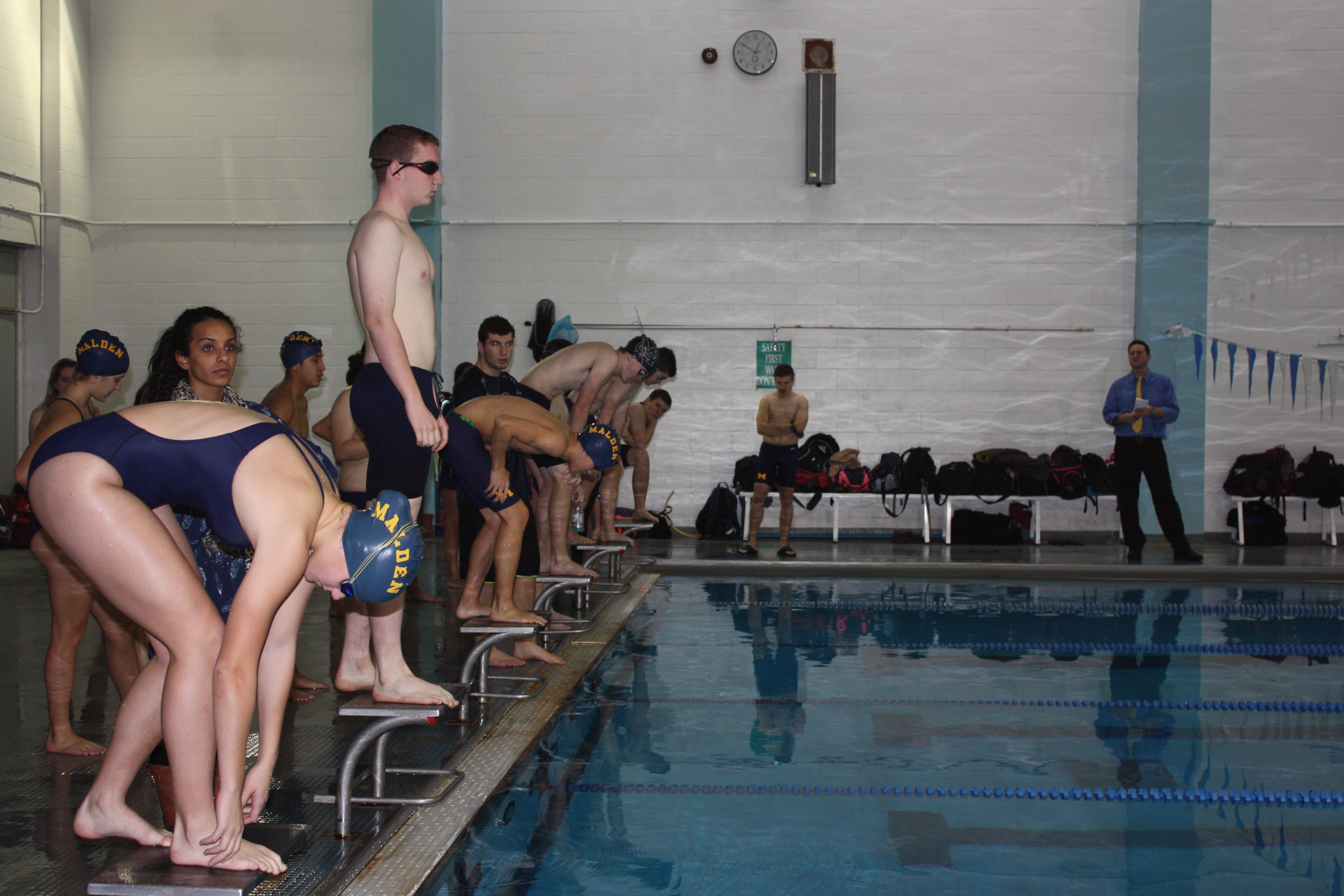 Sophomore Brynn Kankel preparing to dive in the water. Photo by Ana Kerr