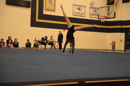 Junior captain Jessica Munroe doing a cartwheel.