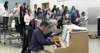 Mixed Chorus teacher, Todd Cole, playing the piano while the class sings along. Photo by Roberto De Oliveira.