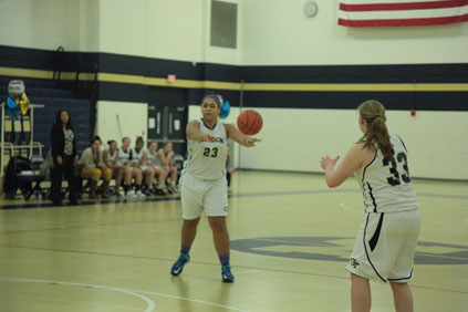 Senior captain Michaela Ilebode passes the ball to senior Samantha Drapinski. All photos by Piero Pocobene.