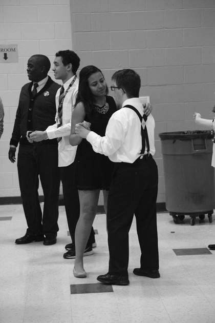 Junior Kevin Irungo, EMARC participant, senior Blue and Gold member Amanda De Moraes during a dance with EMARC member.