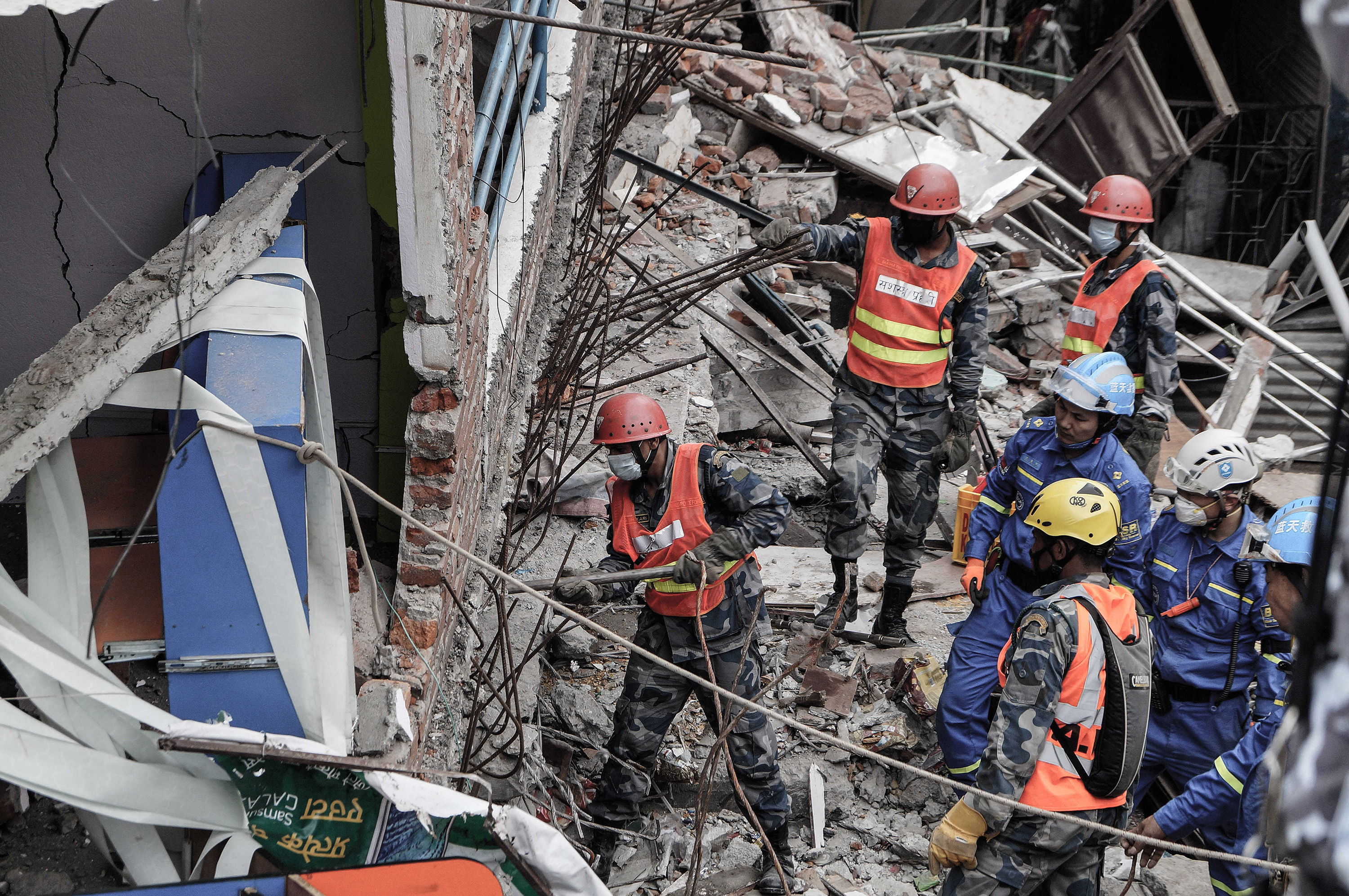 Nepalese rescue personnel search for the bodies of earthquake victims in Kathmandu, Nepal, on Tuesday, April 28, 2015. (Sunil Pradhan/NurPhoto/Zuma Press/TNS)