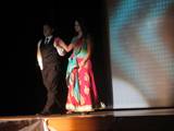 Seniors Madina Khudaynazar and Julio Salazar wearing formal wear during the show.