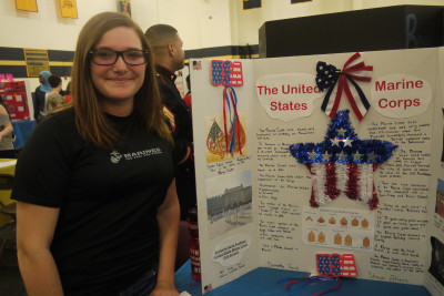 Senior Samantha French showing her internship poster. Photo by Tatyanna Cabral. 