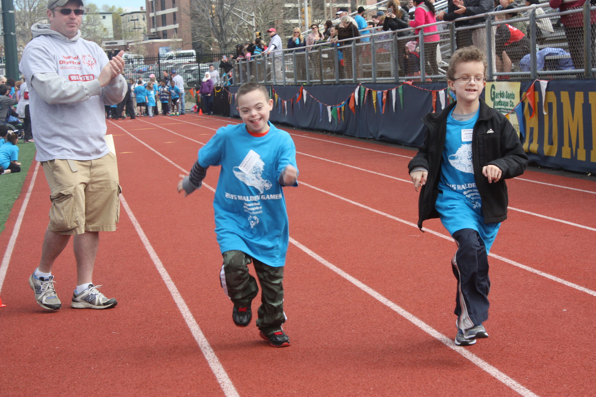 Participants running towards the finish line at the Special Olympics. Photo by Cassandra Reyes. 