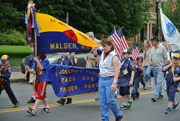 Boy Scout Troop 603 marching down in the parade. Photo by Ashley Leung. 