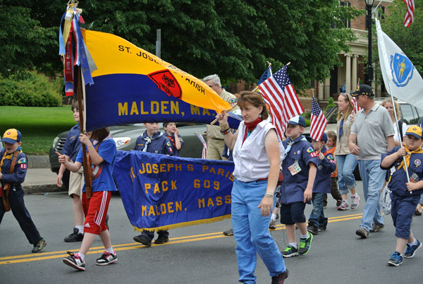 Boy Scout Troop 603 marching down in the parade. Photo by Ashley Leung.