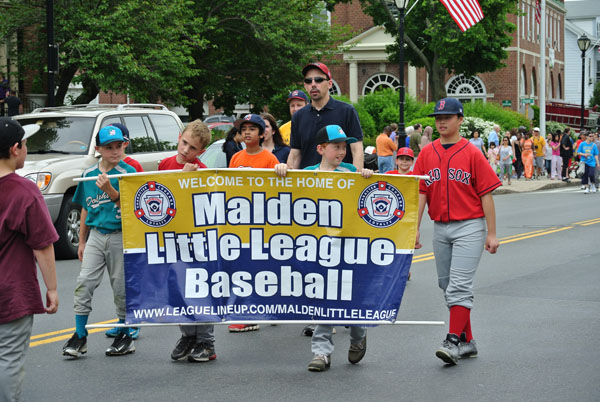 Malden's Little League Baseball team marching in the parade.