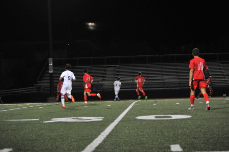 The Malden boys soccer team running upfield. Photo by Ana Kerr.