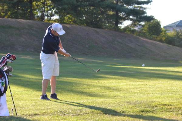Senior Nicholas Andreucci tees off.