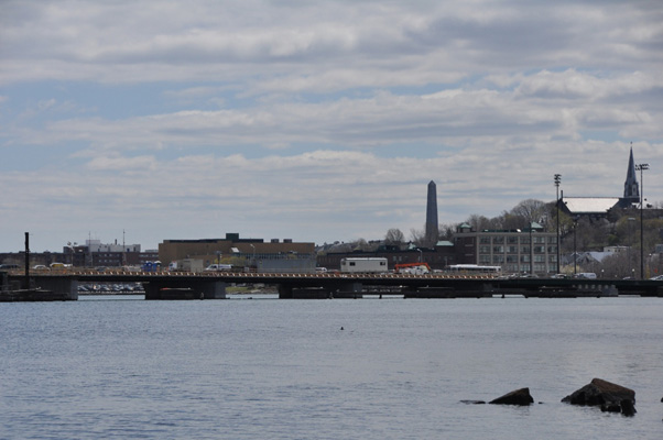 The Alford Street Bridge (also called the Malden Bridge), which carries MA Route 99 across the Mystic River between Charlestown and Everett, Massachusetts. View is from the north (upstream); the Bunker Hill Monument is visible in the background. Photo and caption taken from Wikimedia Commons.