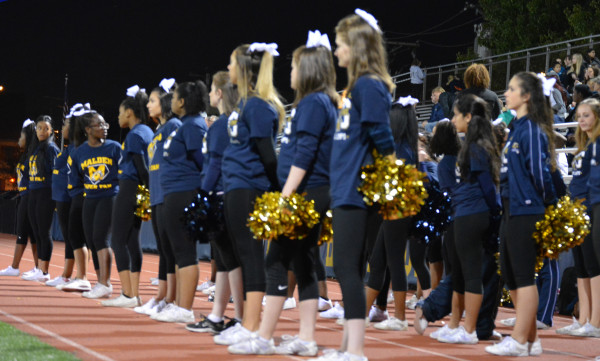 The girls anxiously watching the football game. Photo by Cameron Witham. 