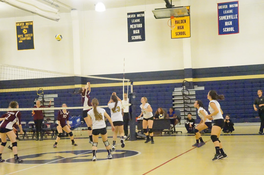 Sophomore Tiffany Tortora bumps the ball back onto the opponent's side. Photo by Alexis Brown.