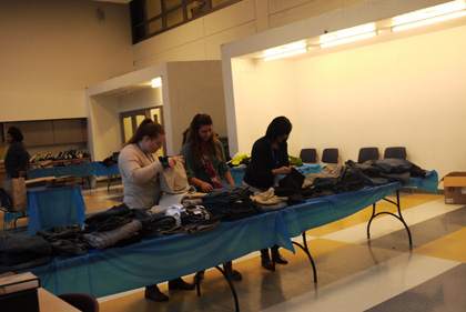 Helpers organizing clothes at Boys and Girls Night Out. Photo by Andrew Cogliano.