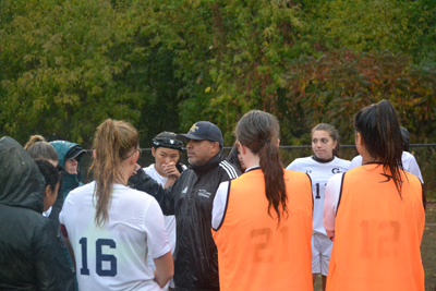 The team in a huddle during half time. Photo by