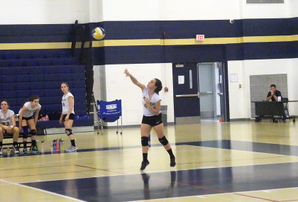 Senior Merjem Rizvancevic hitting the ball. Photo by