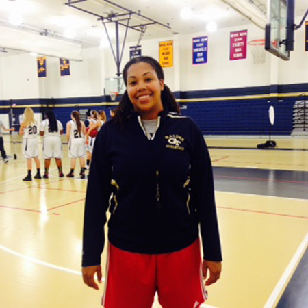 Girls varsity basketball coach Lydia Coverdale posing for a picture. Photo by Neden Bernadin. 