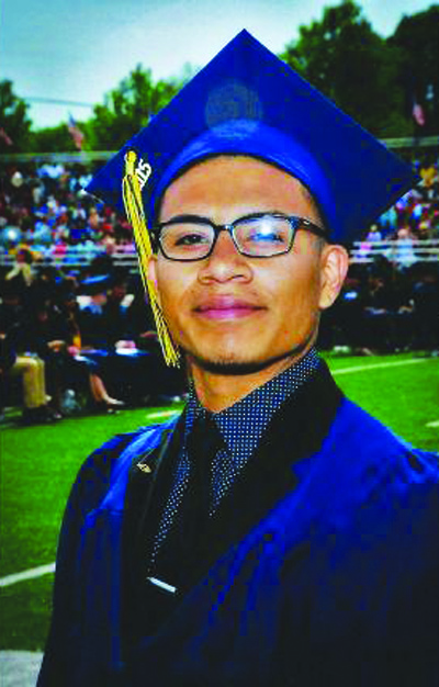 A photo of Josue Quispe at his high school graduation in 2015. Photo provided by Brayan Angulo. 