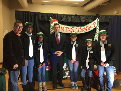 Participants in the puppet show alongside Mayor Gary Christensen at the December Family Day. Photo by Ailin Toro.