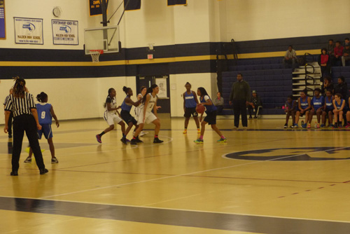 The girls basketball team on defense during their game against Randolph. Photo by Neden Bernadin. 