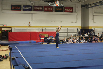 Sophomore Max Weng performing his floor routine. Photo by Tatyanna Cabral. 