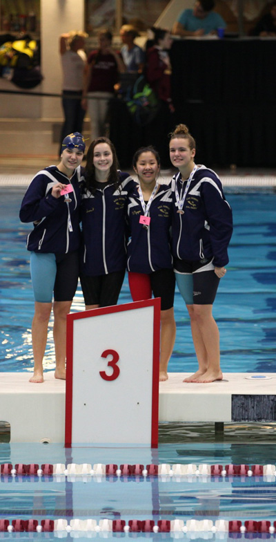 From left to right: Senior Alex Lombardi, senior Samantha Forestier, junior Vivian Nguyen, and junior Felicia Lombardi at the states meet last year. Photo provided by Vivian Nguyen. 