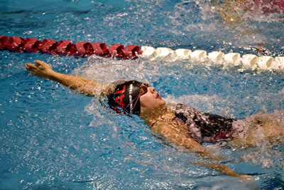 Junior Vivian Nguyen swimming the back stroke. Photo provided by Vivian Nguyen.