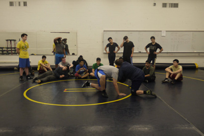 The wrestling team preparing for upcoming meets during their practice. Photo by Joanna Li.