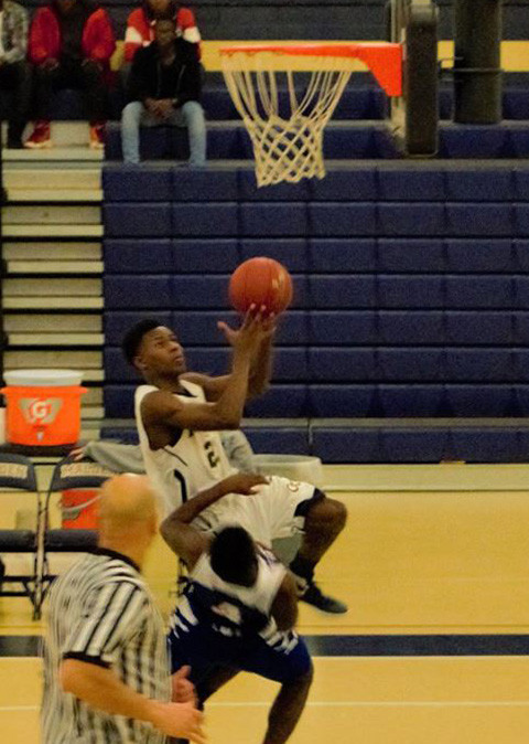 Sophomore Fern Berard attempting a layup.