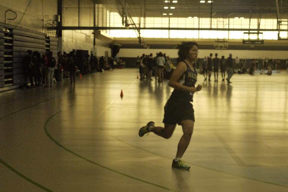 Junior Malisha Zhao running during the meet. Photo by Vivian Dang.