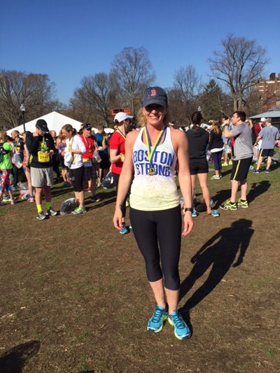 Kerri Floramo posing after completing a race. Photo sumbmitted by Kerri Floramo. 