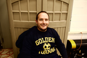 Wrestling coach Jeremiah Smith posing for a picture. Photo by Joanna Li. 