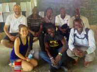 French teacher and Haitian Club advisor Paul Degenkolb with members of the Metanwa School in Haiti. 