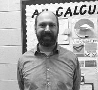 Math teacher Nicholas Lippman posing for a picture. Photo by Felicia Fallano. 