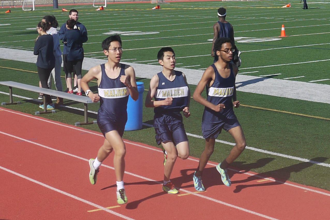 Seniors Angus Mo, James Ao, and Jonathan Solomon running the two mile race. Photo by Alysha McDevitt.