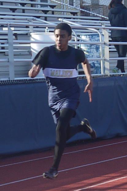Senior Daryl Loreus running the 200m race. Photo by Alysha McDevitt. 