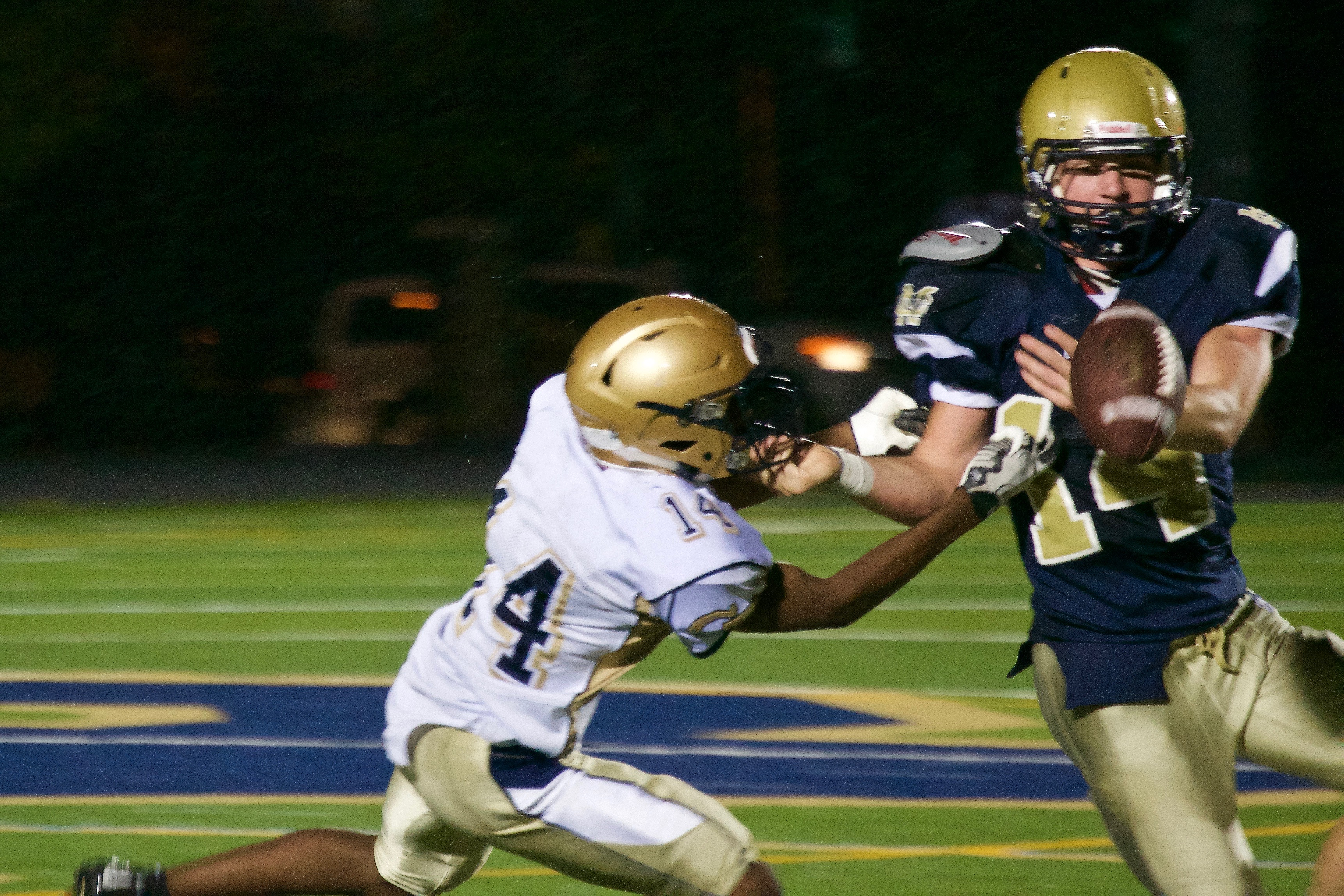 Junior Edward Bazile breaks up a pass intended for Lancer star running back, Kellen Field. Photo taken by Abhishek Rana.  