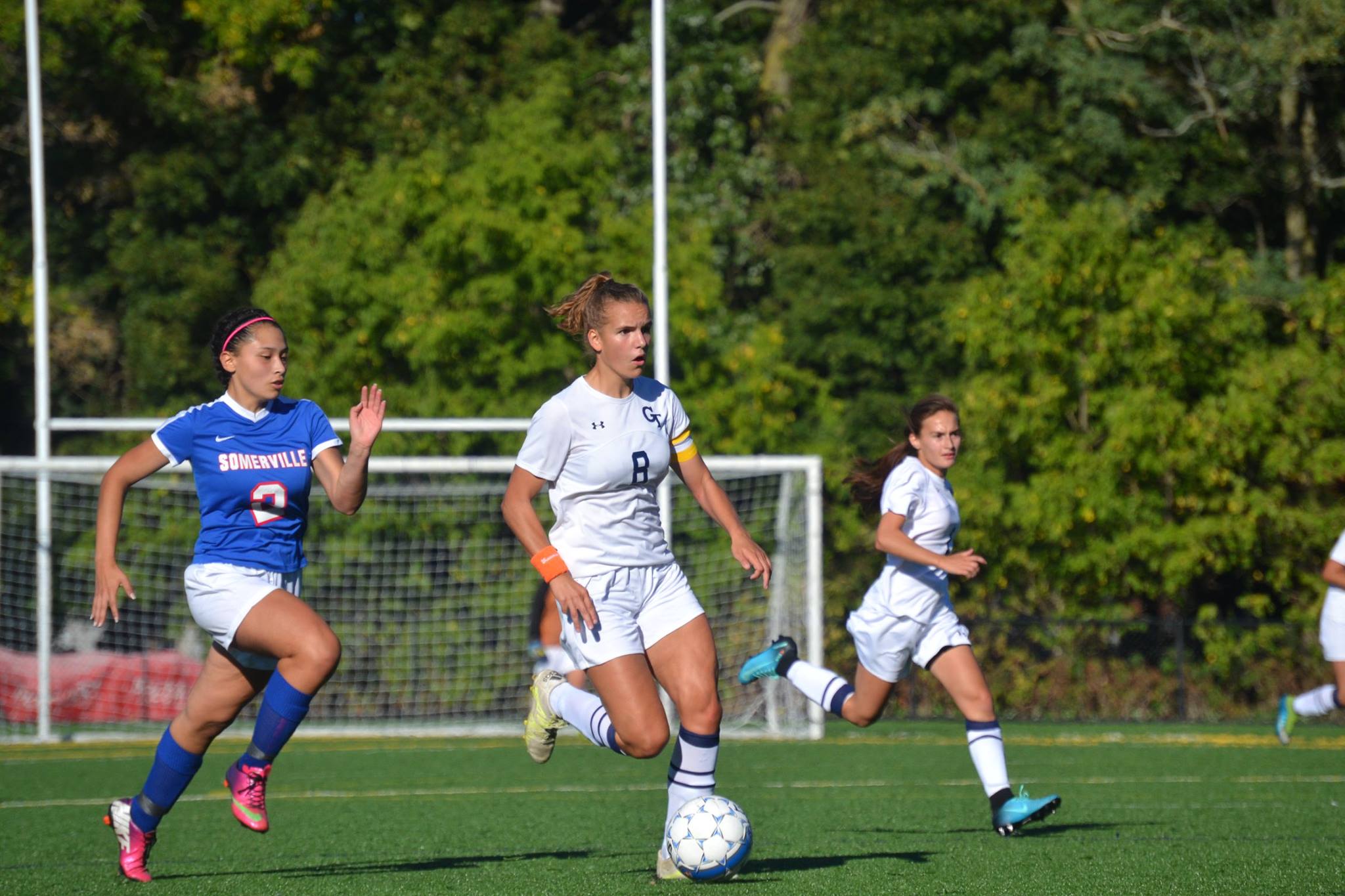 Senior Felicia Lombardi keeps control of the ball as she gets ready to shoot.