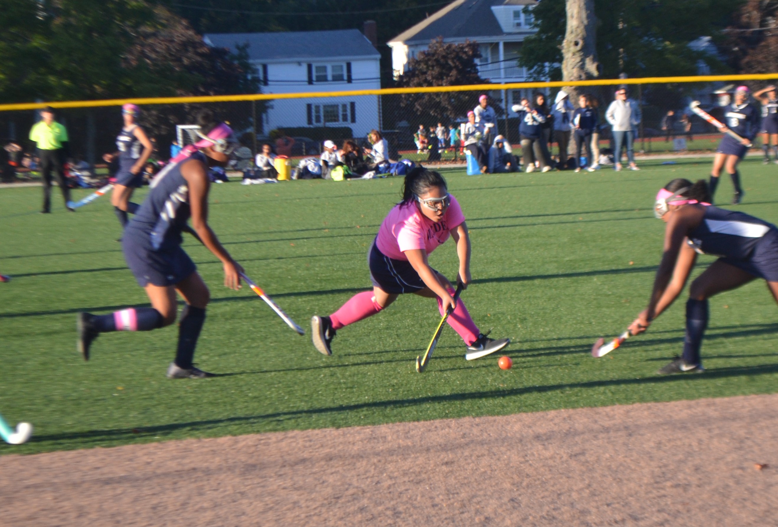 Sophomore Queenie Dang keeping ball away from opponent. 