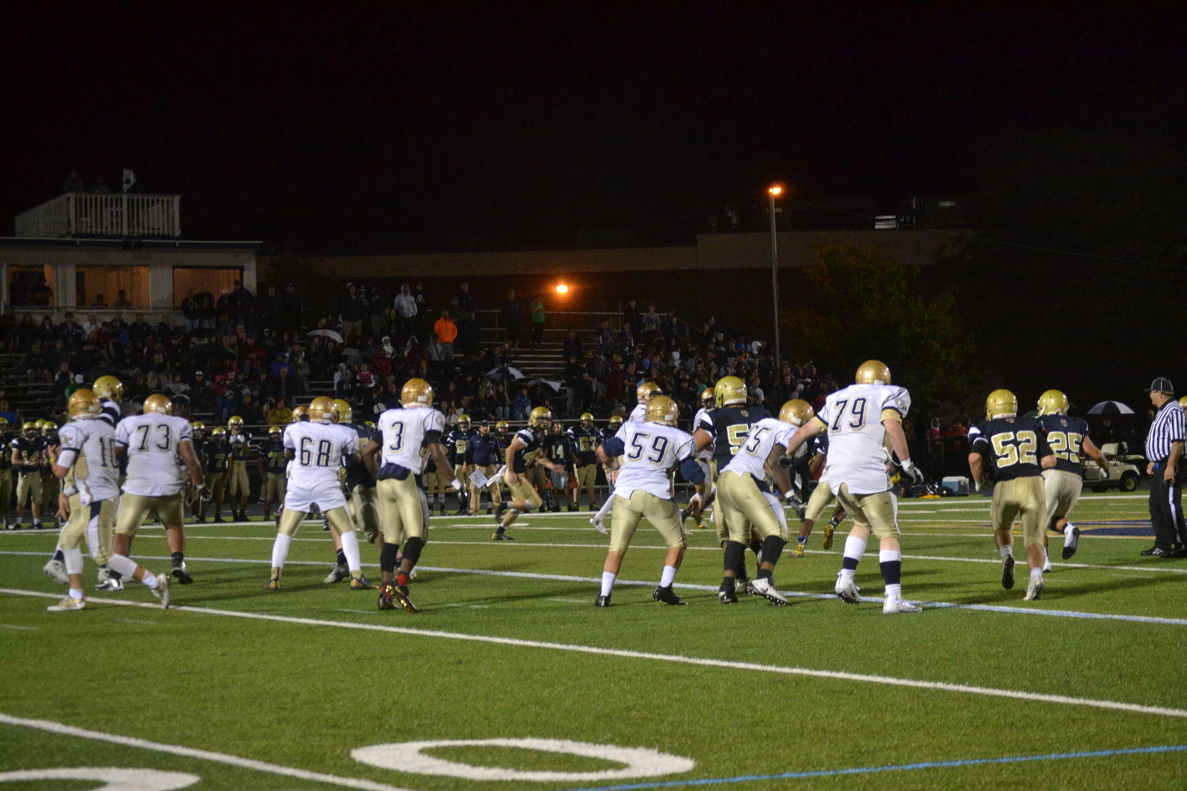 MHS defense goes after the ball carrier. Photo taken by Abhishek Rana. 