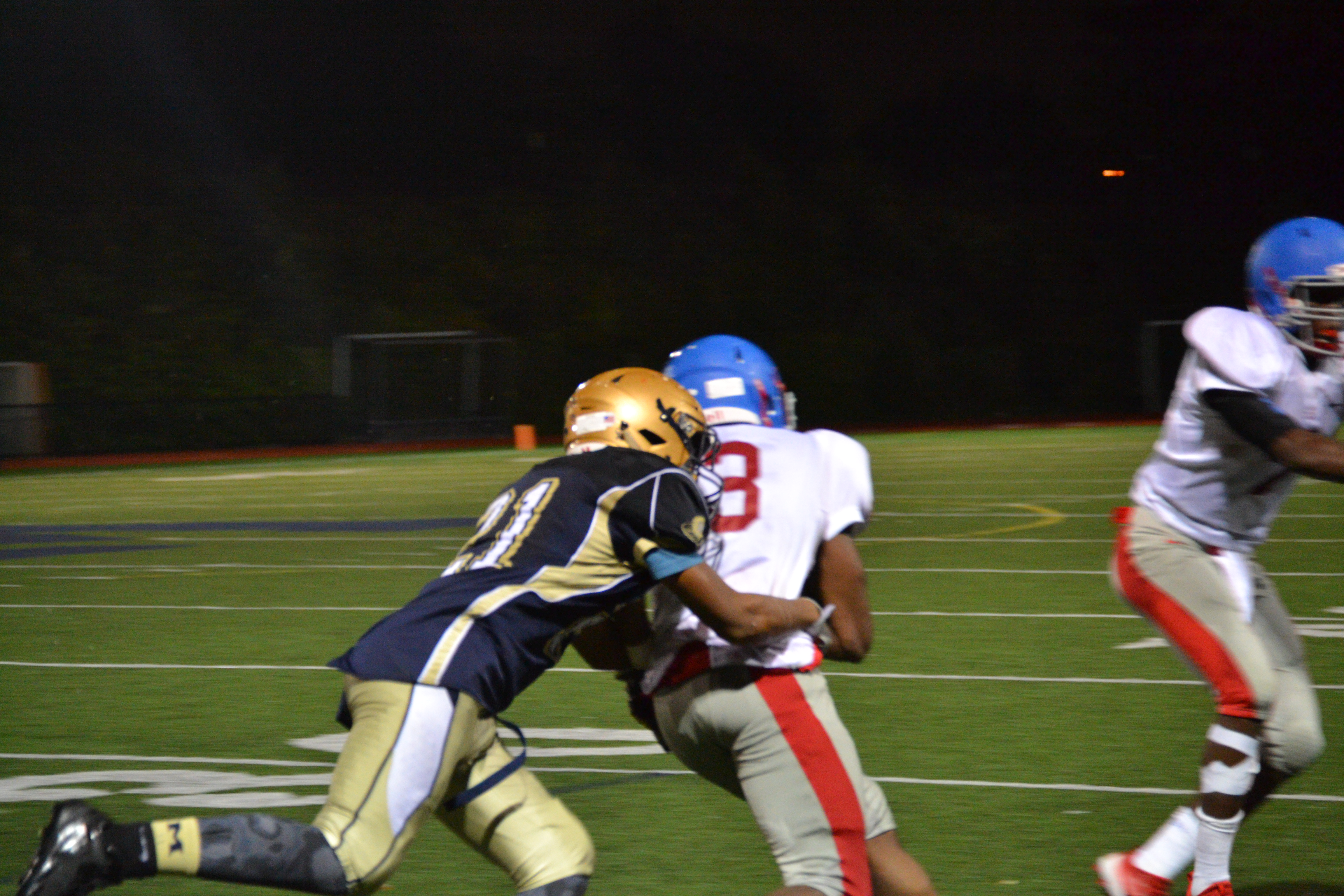 Sophomore Kamerin Williams tackling a Somerville player. Photo by Abhishek Rana.