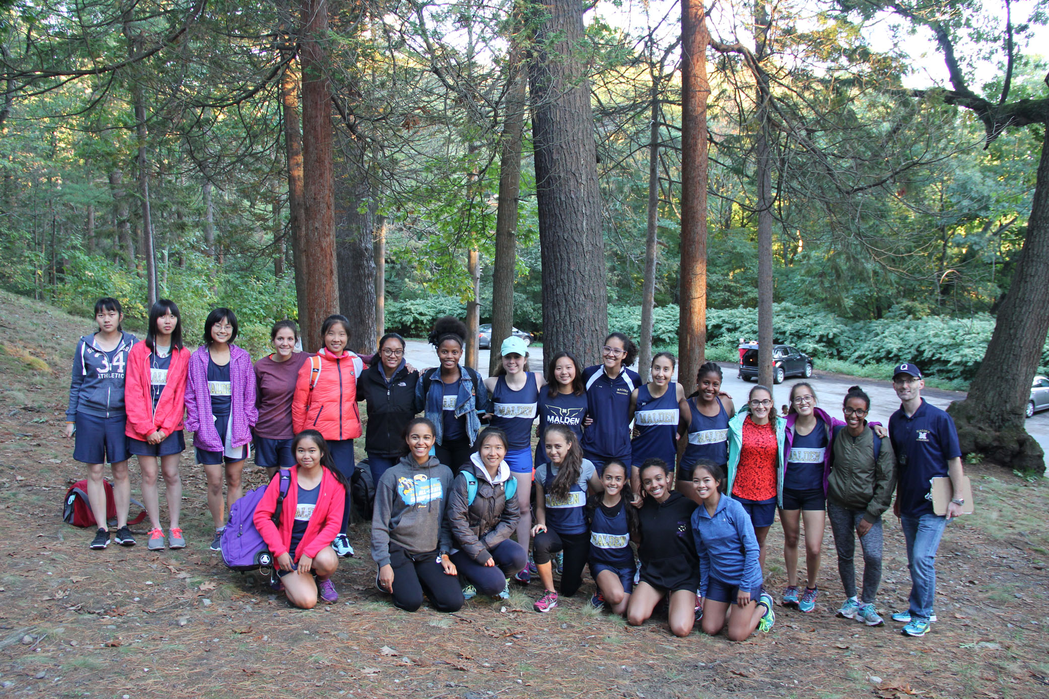 The Girls Cross Country team and Coach Londino. Photo by Sara Zakaria.  