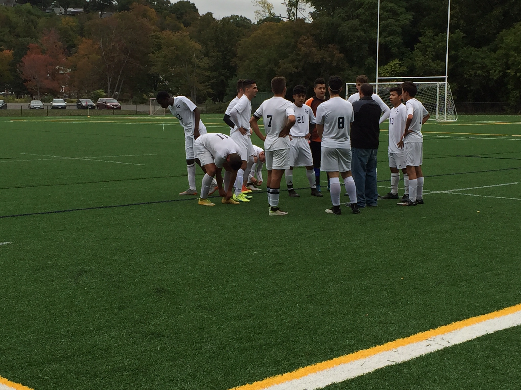 Boys varsity soccer team huddling up. Photo taken by Subin Bastola. 