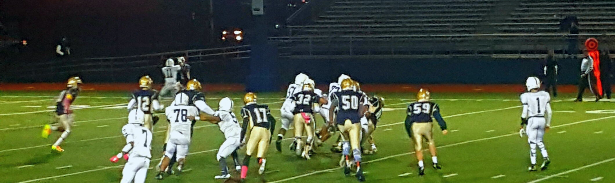 Malden High School defense going after the ball carrier. Photo by Tenzin Dorjee.