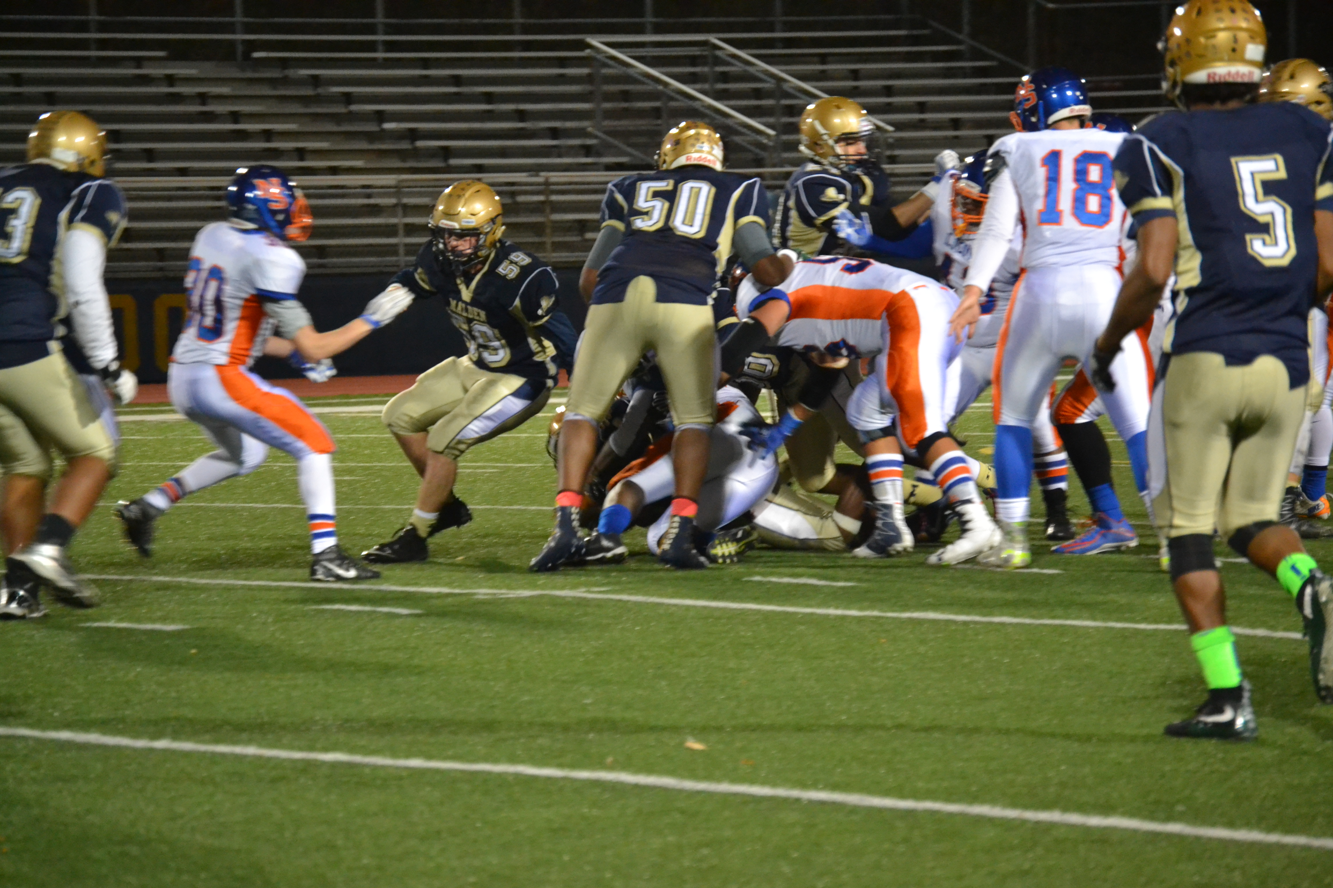 Malden offense trying to gain yards. Photo by Abhishek Rana. 