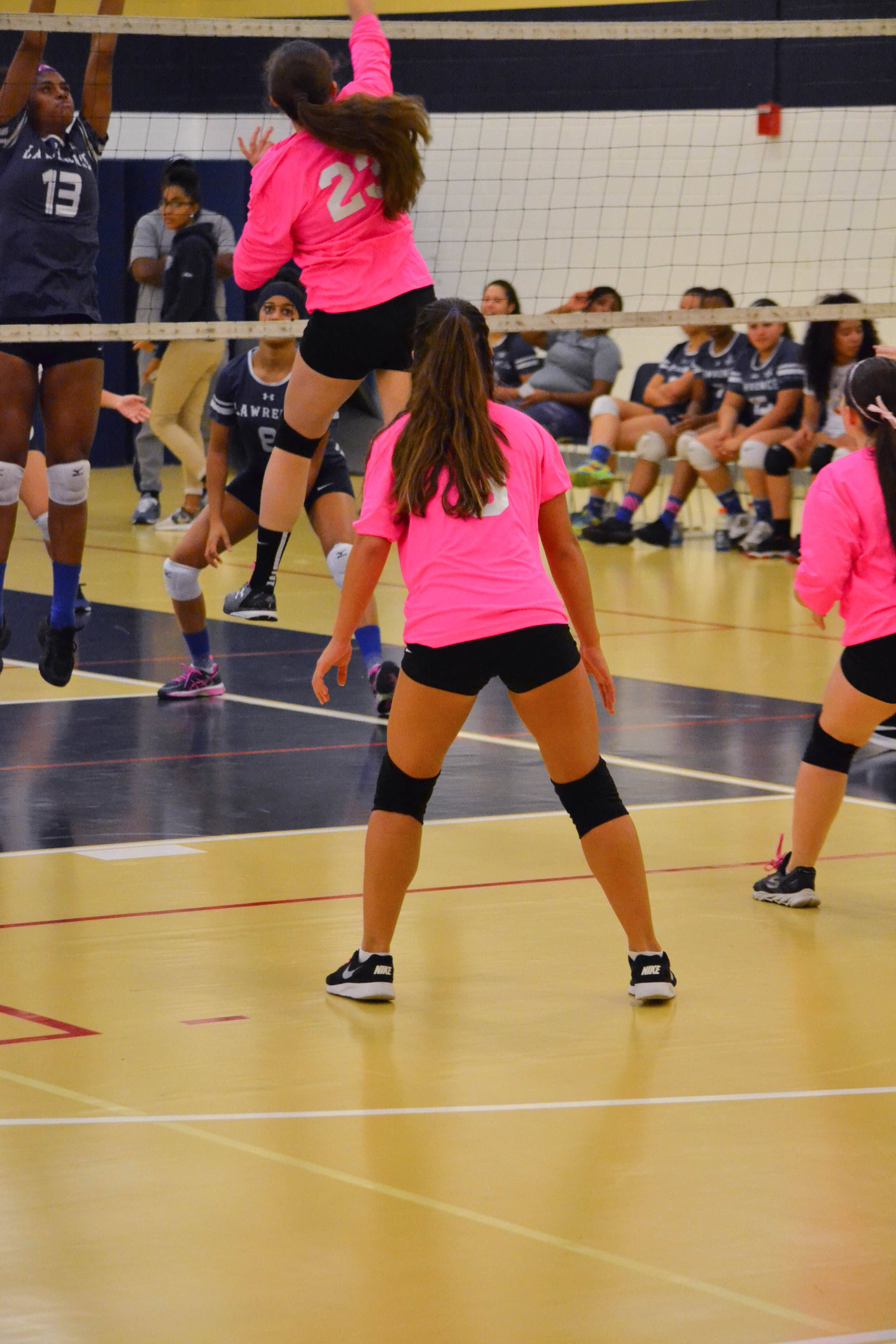 Junior Tiffany Tortora hitting the ball and scoring a point against Lawerence. Photo submitted by Daisy Depina. 