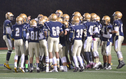 Team huddling before the start of the game. Photo by Abhishek Rana.